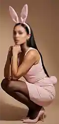 Bee Woman posing in pink bunny costume and heels