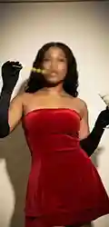 soraia Woman posing in red strapless dress and black gloves